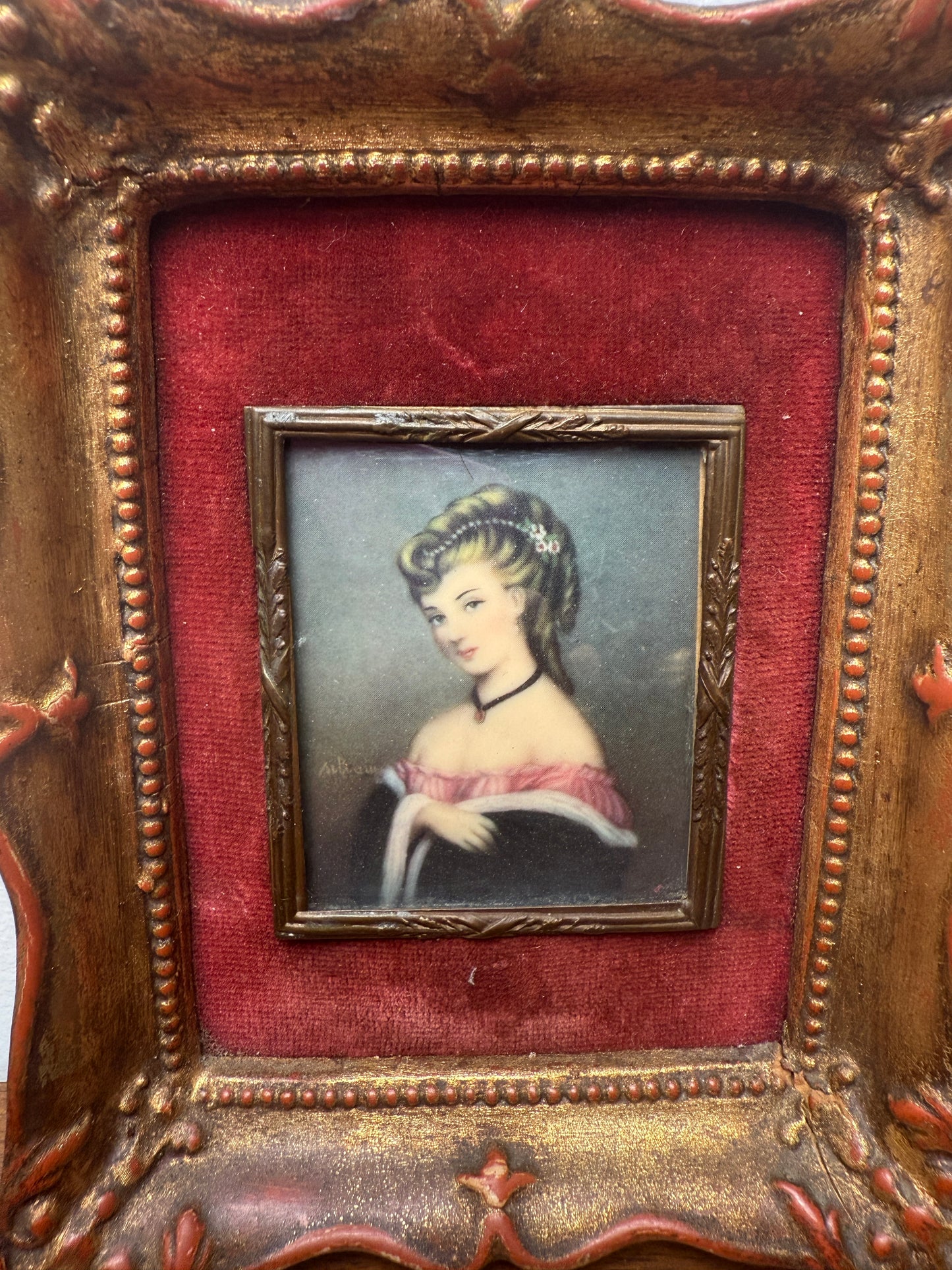 Antique miniature portrait of lady with red velvet matting