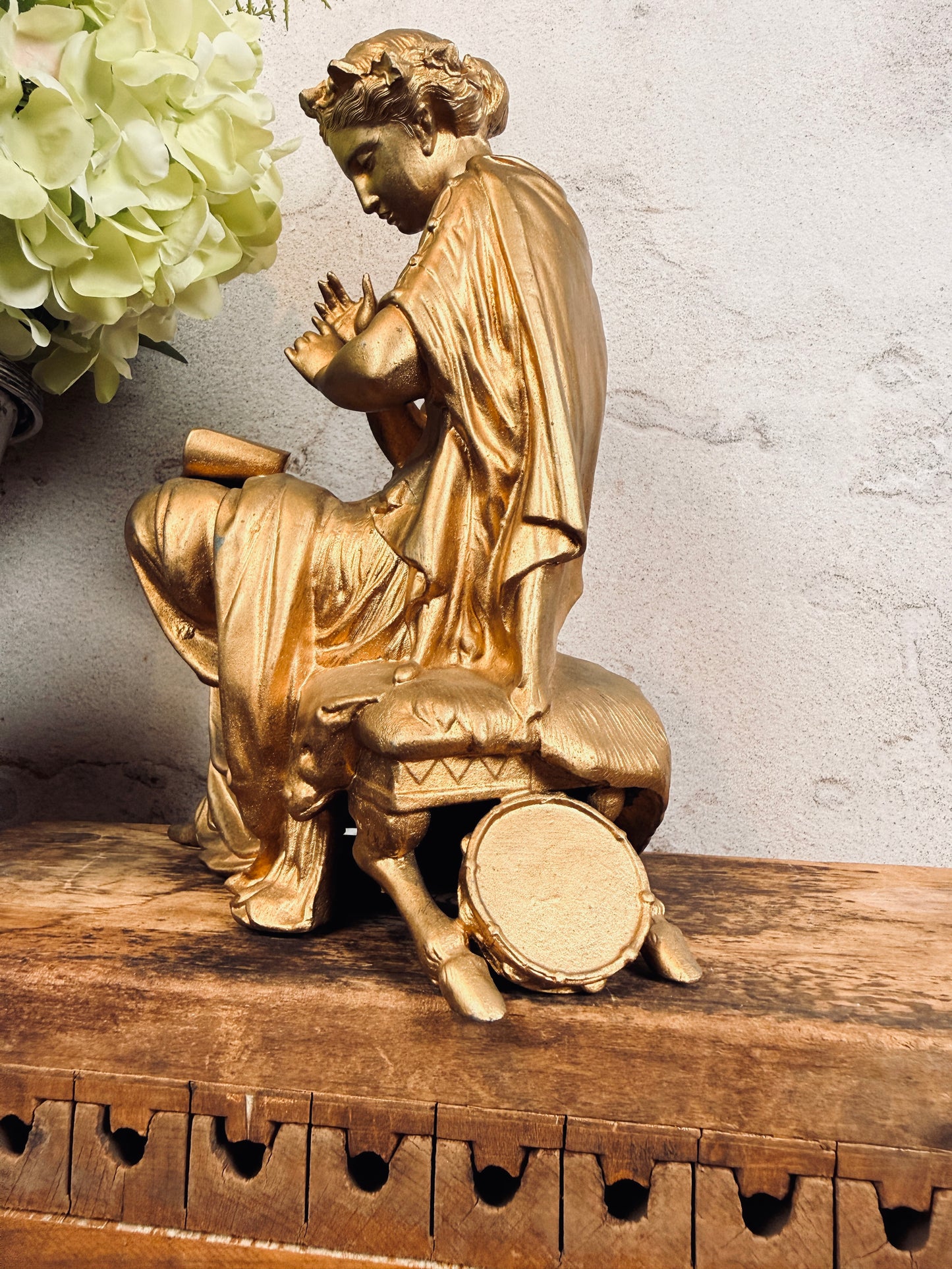 Spelter figural clock topper with laurel crown, sheet music & tambourine