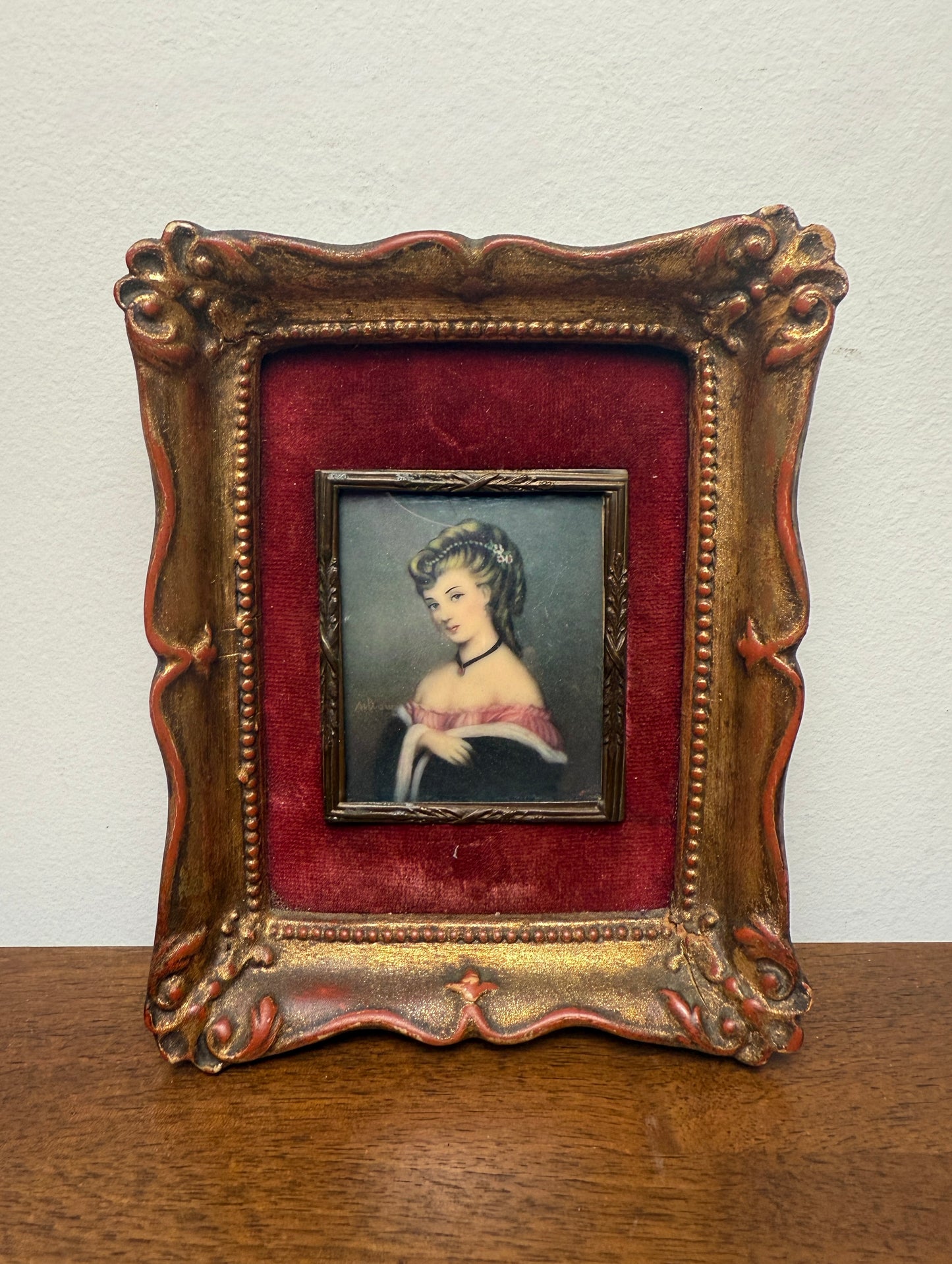 Antique miniature portrait of lady with red velvet matting