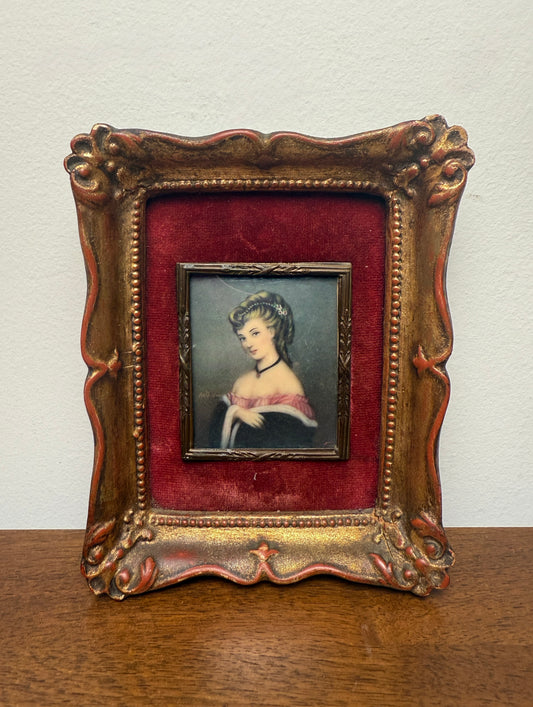 Antique miniature portrait of lady with red velvet matting