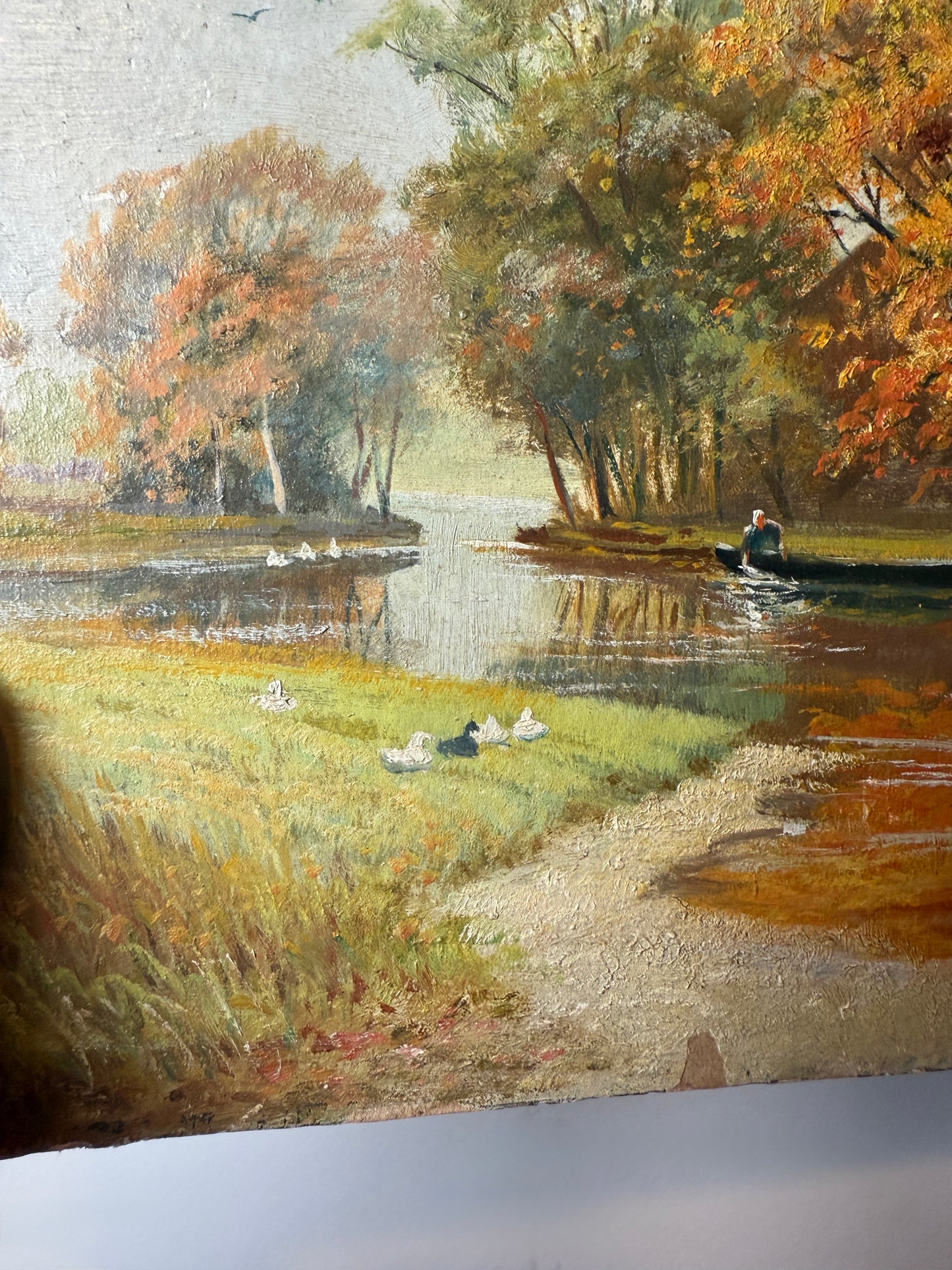 Autumn river landscape with boats and farmhouse, signed A. Renauld 194*