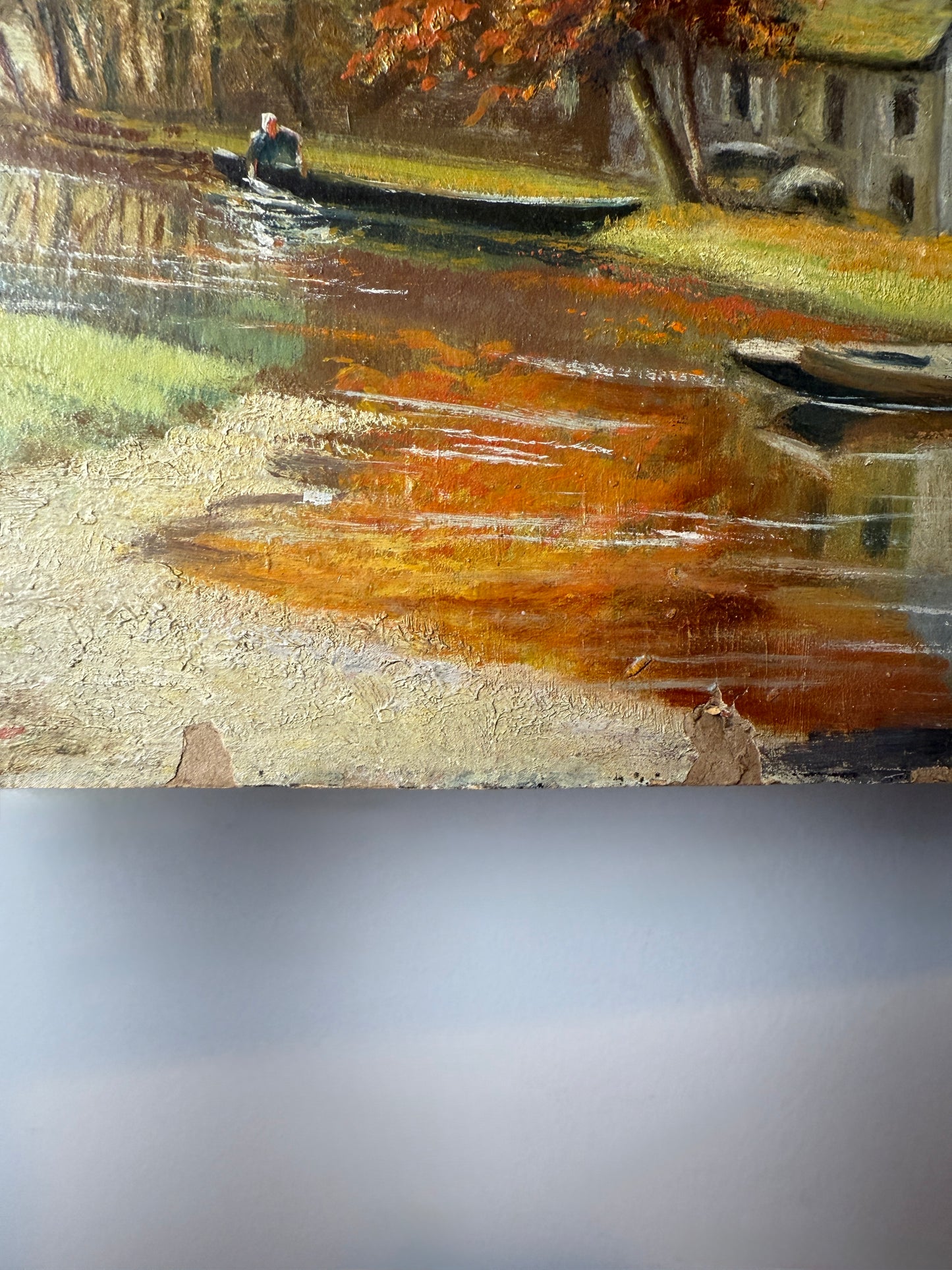 Autumn river landscape with boats and farmhouse, signed A. Renauld 194*