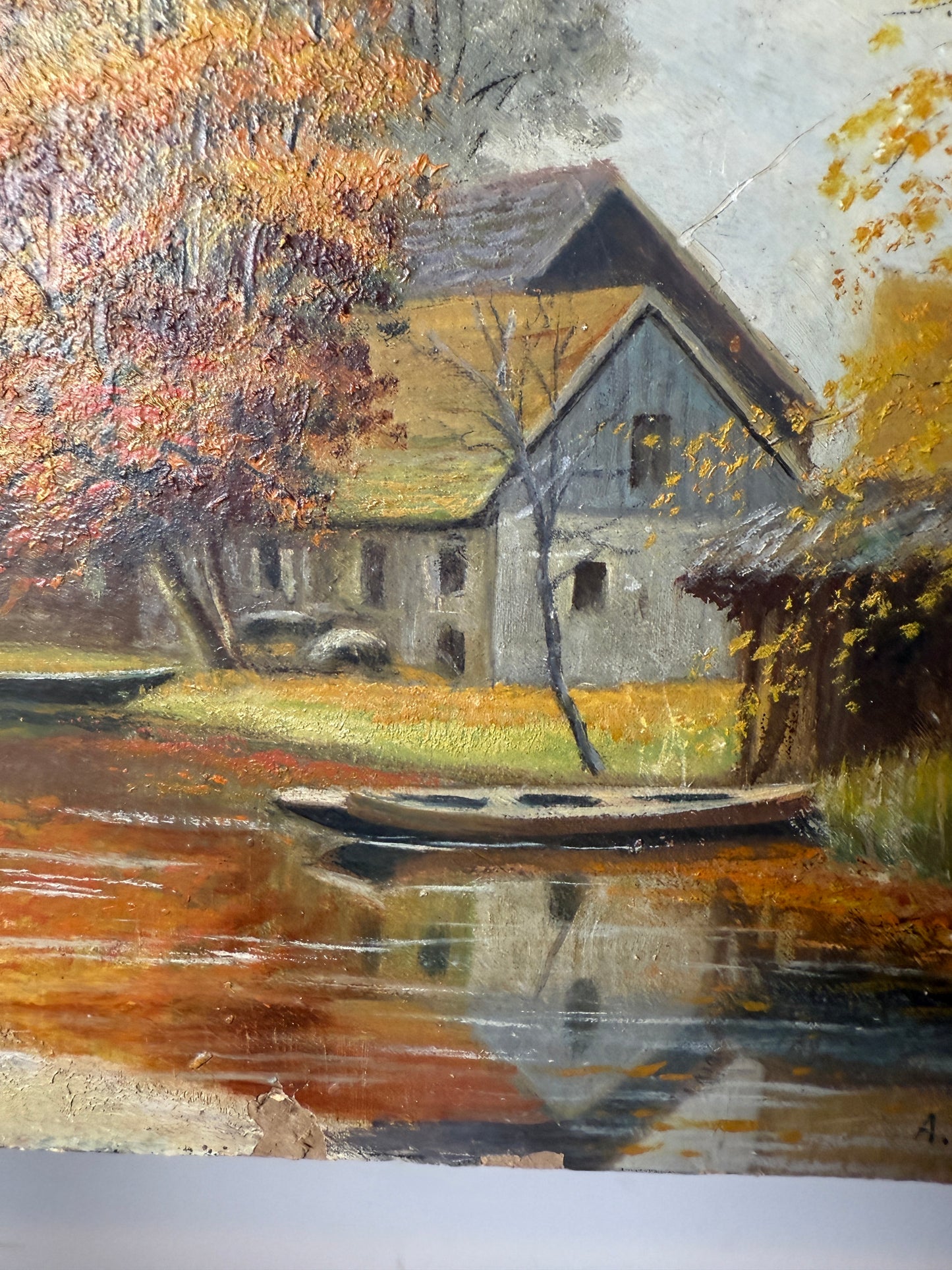 Autumn river landscape with boats and farmhouse, signed A. Renauld 194*