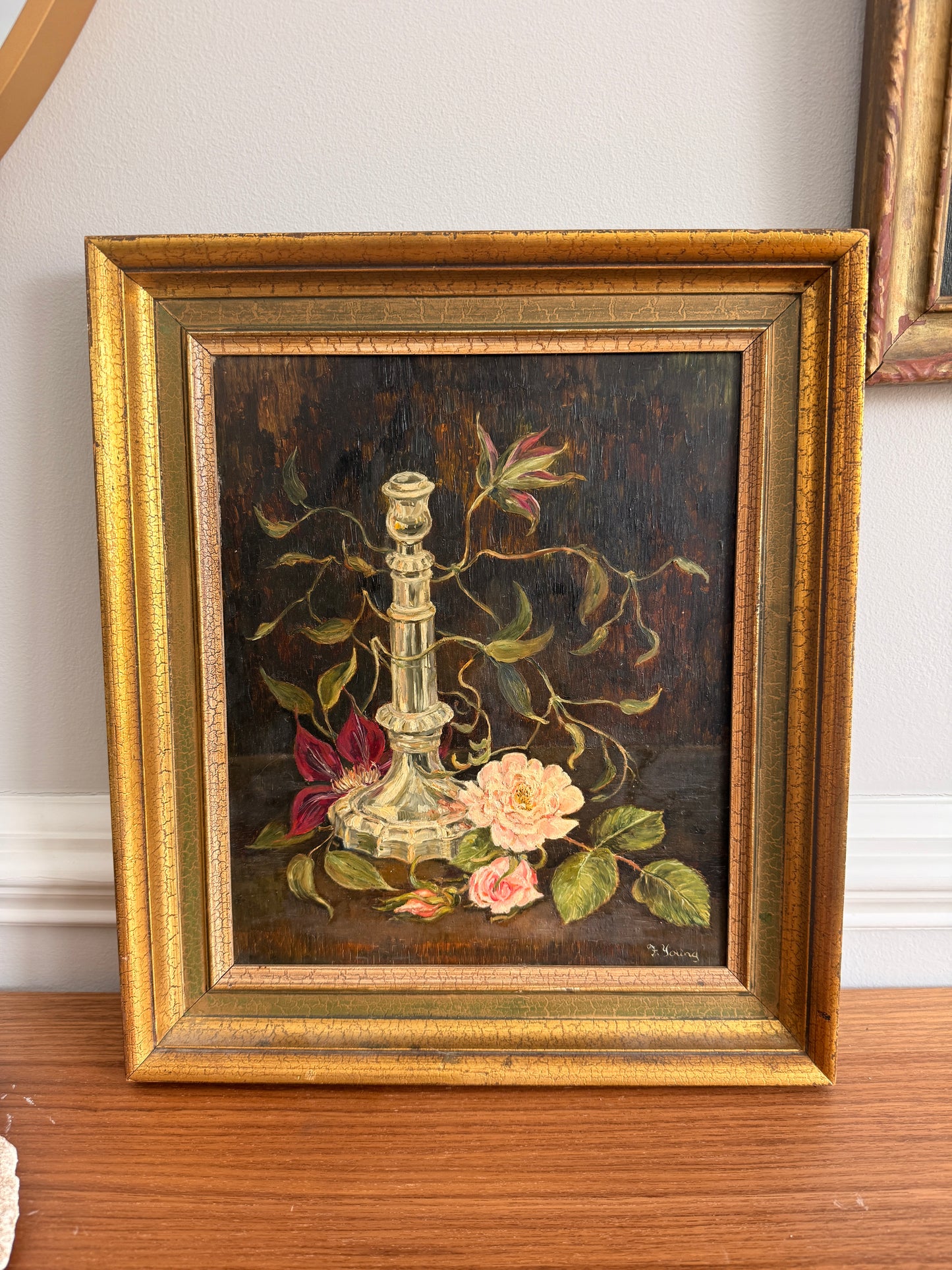 Still life of crystal candlestick with roses & clematis