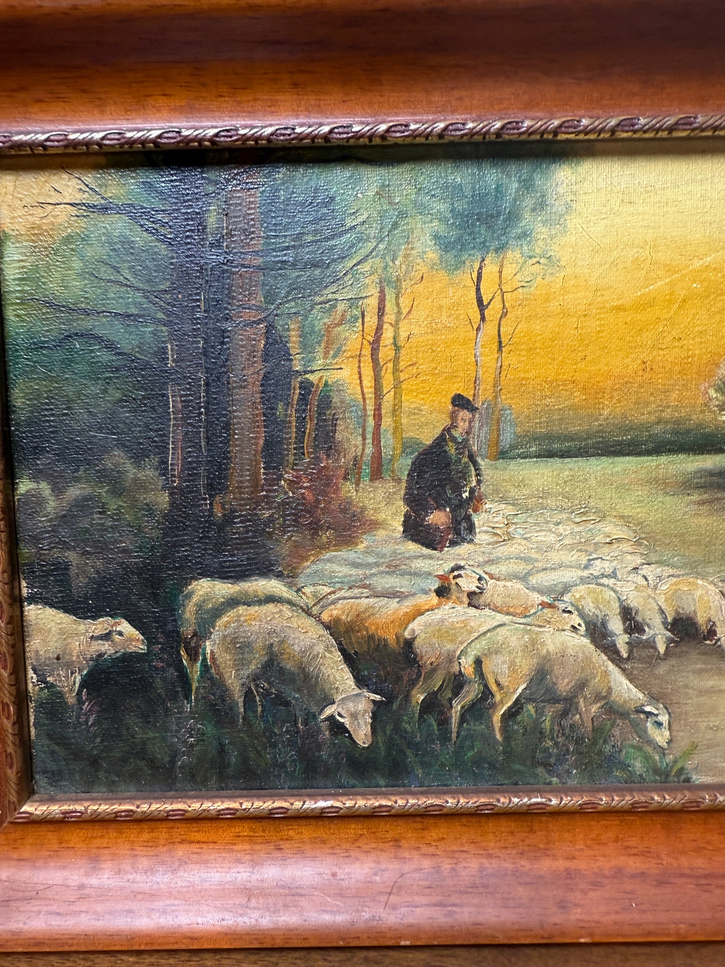 Shepherd with flock in pastoral landscape